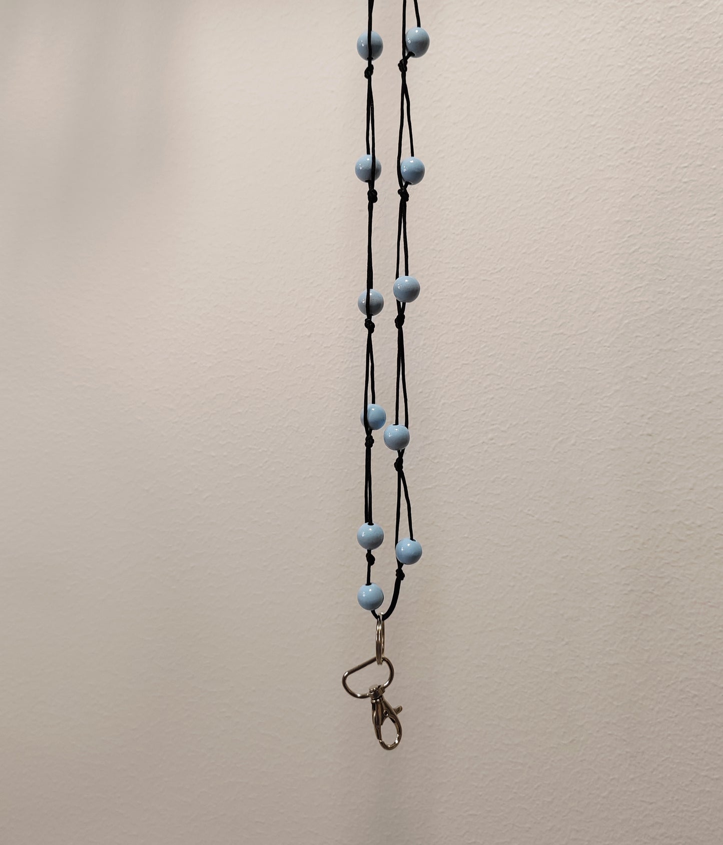 Olan yli avainnauhat (musta nauha)